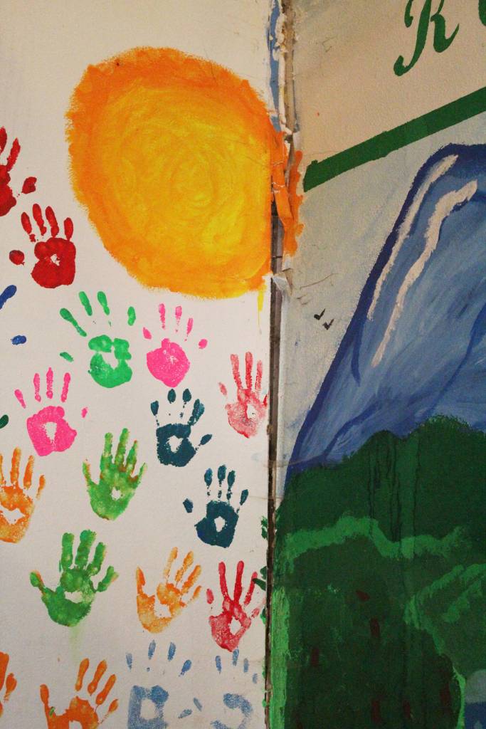 A crack that had been painted over spreads up the corner where two walls meet in one of the Kachemak School buildings, and continues along the ceiling, on Thursday, Aug. 30, 2018 in Kachemak Selo, Alaska. Theres an opportunity for the Kenai Peninsula Borough to replace the three buildings with a new, more consolidated school on a different site in the village, thanks to a grant program offered through the State of Alaska. The state would contribute $10 million to the project if borough voters approve going out to bond for up to $5 million in matching funds. (Photo by Megan Pacer/Homer News)