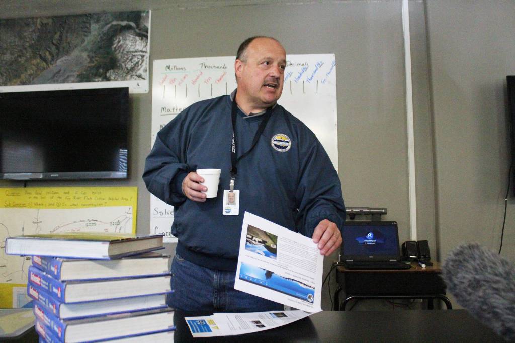 Kenai Peninsula Borough School District Superintendent Sean Dusek talks about project information the borough and school district have put online about the proposed new school for Kachemak Selo students during a community meeting Thursday, Aug. 30, 2018 in the village at the head of Kachemak Bay, Alaska. Dusek and others emphasized that they are restricted by borough code in terms of what they are allowed to say or publish about the project the proposed general obligation bonds to pay for it, which borough residents will vote on in October. (Photo by Megan Pacer/Homer News)