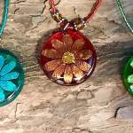 Liz Bowens dichroic glass and metal jewelry is featured in her new show opening Sept. 7, 2018, at the Art Shop Gallery, Homer, Alaska. (Photo provided)