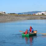 A man rows a young girl around the Nick Dudiak Fishing Lagoon in a wooden boat Saturday, Sept. 1, 2018 during the Kachemak Bay Wooden Boat Festival on the Homer Spit in Homer, Alaska. (Photo by Megan Pacer/Homer News)