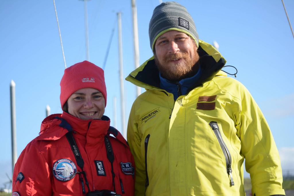 Anna Vazhenina , left,and Anatoly Kazakevich, right, pose for a photo on their inflatable catamaran, Iskatel, last Thursday morning, Aug. 30, 2018, at the Homer, Alaska, harbor. They finished sailing from Lake Baikal, Russia, to Homer, on Aug. 26. (Photo by Michael Armstrong/Homer News)