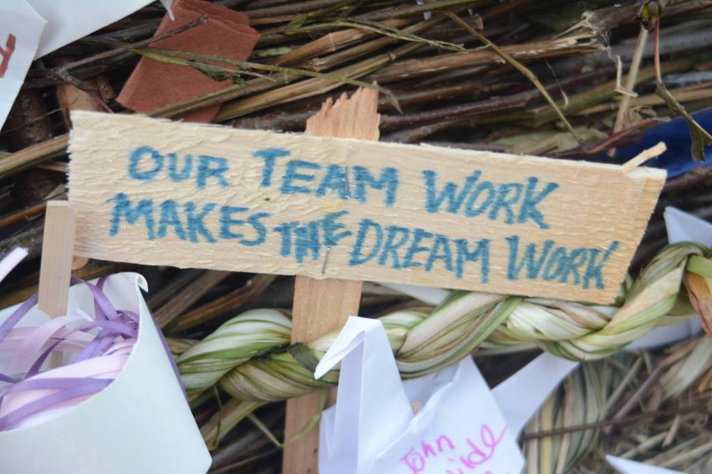 Signs and other objects adorn the 2018 Burning Basket, Dream, on Sept. 9, 2018 at Mariner Park in Homer, Alaska. (Photo by Michael Armstrong/Homer News)