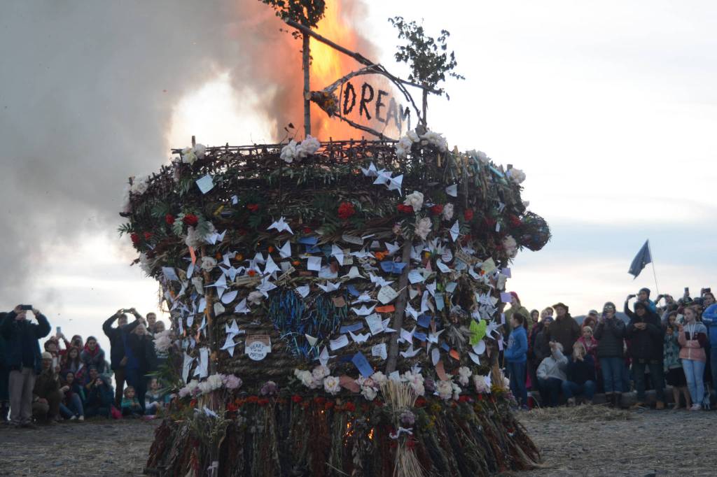 The 2018 Burning Basket, Dream, catches fire on Sept. 9 at Mariner Park, Homer, Alaska. (Photo by Michael Armstrong/Homer News)