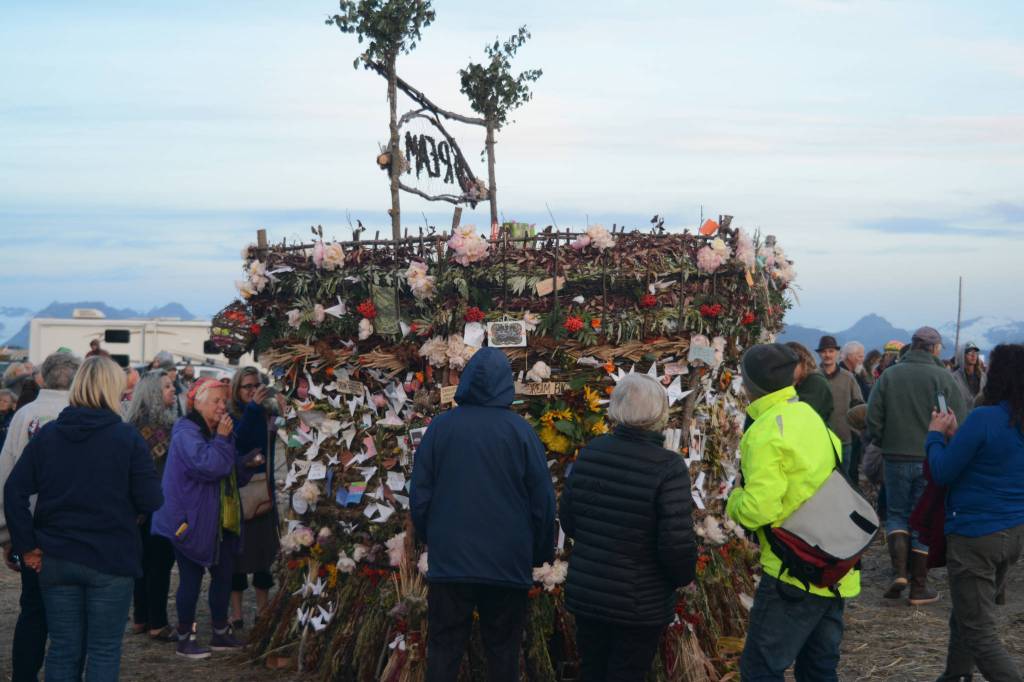 Visitors interact with the 2018 Burning Basket, Dream, on Sept. 9 at Mariner Park, Homer, Alaska. (Photo by Michael Armstrong/Homer News)
