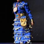 Sheena Cain performs the Anishinaabe side step in whats called a Jingle Dress on Thursday, Sept. 6, 2018 in the Homer High School Mariner Theatre in Homer, Alaska. She is part of the group Native Pride Dancers that traveled from Minnesota for several performances on the Kenai Peninsula. (Photo by Megan Pacer/Homer News)