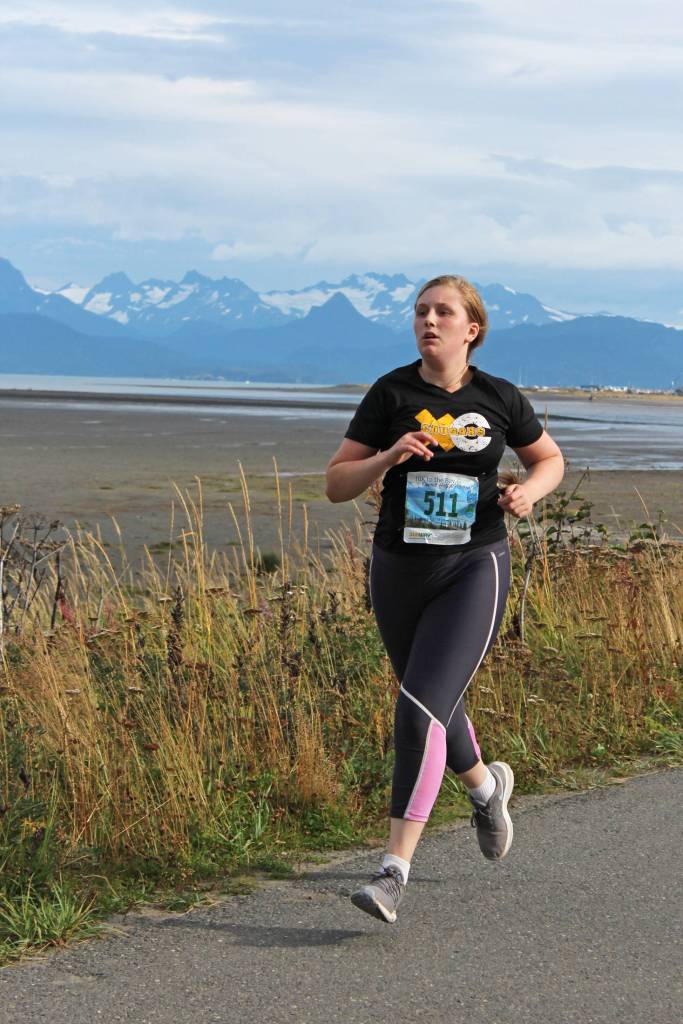 Fenya Martushoff, a Voznesenka junior, nears the finish line of the 5K Homer Invitational on Friday, Sept. 7, 2018 on the Homer Spit in Homer, Alaska. Voznesenka had two runners at the event. (Photo by Megan Pacer/Homer News)