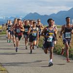 Cross-country runners take off from the starting line of the boys 5K Spit Run during the Homer Invitational on Friday, Sept. 7, 2018 on the Homer Spit in Homer, Alaska. The Soldotna boys team took first place, beating the Homer boys team by four points. (Photo by Megan Pacer/Homer News)