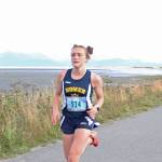 Homers Autumn Daigle reaches the finish line of the 5K girls race to win the Homer Invitational cross-country meet Friday, Sept. 7, 2018 on the Homer Spit in Homer, Alaska. (Photo by Megan Pacer/Homer News)