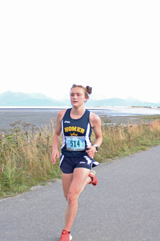 Homers Autumn Daigle reaches the finish line of the 5K girls race to win the Homer Invitational cross-country meet Friday, Sept. 7, 2018 on the Homer Spit in Homer, Alaska. (Photo by Megan Pacer/Homer News)