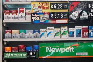 In this Thursday, May 18, 2017 file photo, packs of cigarettes are offered for sale at a convenience store in Helena, Mont. Tobacco companies have made claims about cigarettes since the 1950s, all later proven false. In some cases the introduction of these products, such as filtered and cigarettes, propped up cigarette sales and kept millions of Americans smoking. Although the adult smoking rate has fallen to an all-time low of 15 percent in 2017, smoking remains the nations leading preventable cause of death and illness, responsible for about one in five U.S. deaths. (AP Photo/Bobby Caina Calvan)