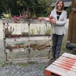 Karen Berger at Homer Brewing stands by her appealing application of pallets on Sept. 21, 2018, in Homer, Alaska. (Photo by Rosemary Fitzpatrick)