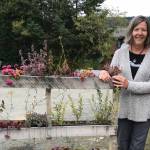 Karen Berger at Homer Brewing stands by her appealing application of pallets on Sept. 21, 2018, in Homer, Alaska. (Photo by Rosemary Fitzpatrick)