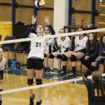 Homers Marina Carroll jumps to set the ball over the net to Seward High School during one of their games Saturday, Sept. 22, 2018 at the Alice Witte Gymnasium in Homer, Alaska. (Photo by Megan Pacer/Homer News)