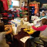 Students from the community help make boomerang bags at the Center for Alaskan Coastal Studies in Homer, Alaska, in October 2017. The center is spearheading an effort to localize the bags, which are the product of an international organization that encourages communities to make the bags as a replacement for plastic ones. (Photo courtesy Beth Trowbridge)