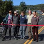 Five of the six Homer City Council members (from left to right: Donna Aderhold, Shelly Erickson, Caroline Venuti, Heath Smith and Rachel Lord) smile at the grand opening for the extended Greatland Street on Tuesday, Sept. 25, 2018 in Homer, Alaska. (Photo by Megan Pacer/Homer News)