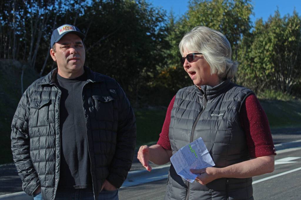 Homer City Council member Shelly Erickson speaks about the Greatland Street expansion and how it came to fruition after the idea was brought to her by Save-U-More Assistant Manager Brian Nahmis, left, during a grand opening ceremony Tuesday, Sept. 25, 2018 in Homer, Alaska. (Photo by Megan Pacer/Homer News)