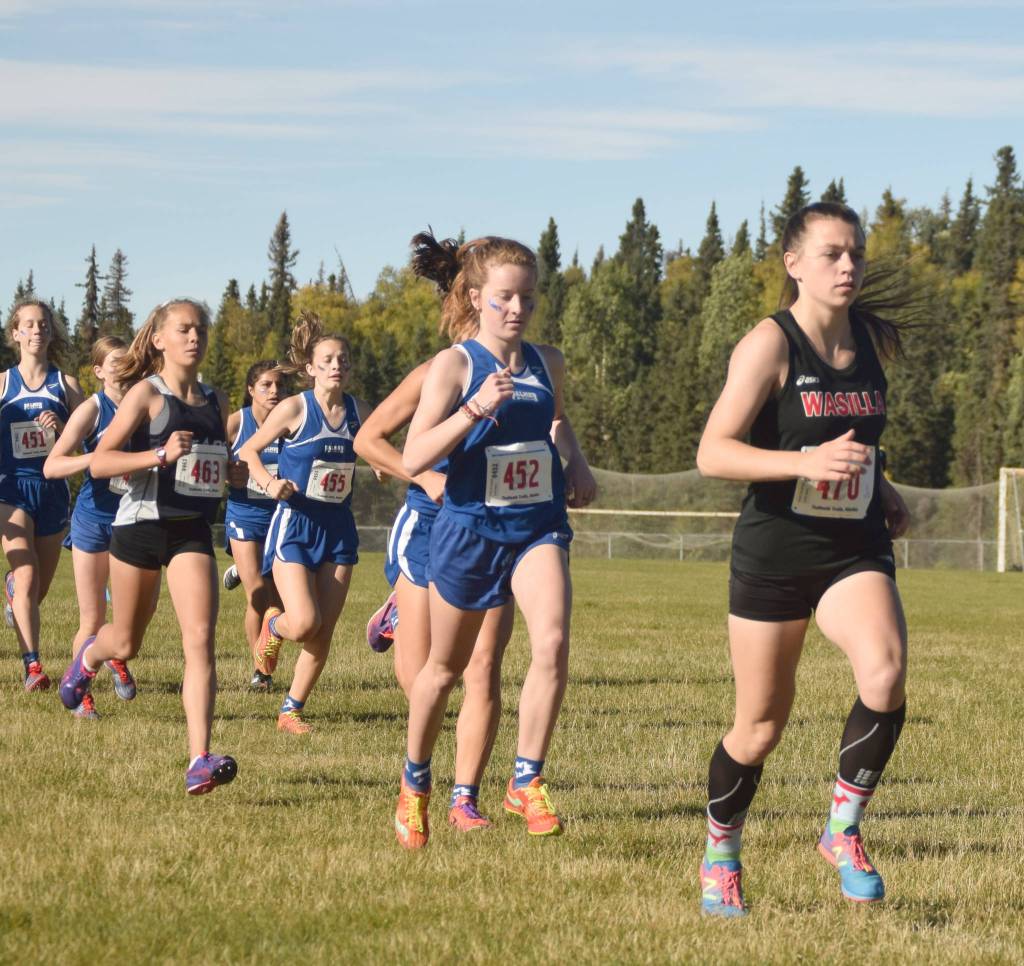 Soldotnas Jordan Strausbaugh tucks in behind Wasillas Allison VanPelt and Palmers Katey Houser early in the Division I girls race at the Region 3 meet Saturday, Sept. 22, 2018, at Tsalteshi Trails. (Photo by Jeff Helminiak/Peninsula Clarion)