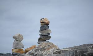 Two rock sculptures are part of dozens an artist made along the Homer Spit last week, as seen in this photo taken Friday, Sept. 21, 2018, in Homer, Alaska. (Photo by Michael Armstrong/Homer News)