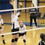 Homers Marina Carroll jumps to block a ball during the Lady Mariners game against Houston High School on Saturday, Sept. 29, 2018 in Homer, Alaska. (Photo by Megan Pacer/Homer News)