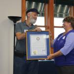 During the Homer Marine Trades meeting on Friday, Sept. 28, 2018, in Homer, Alaska, Rep. Paul Seaton presented Kate Mitchell with a Legislative Citation recognizing NOMARs contributions to the southern Kenai Peninsula in the past 40 years. (Photo by McKibben Jackinsky)