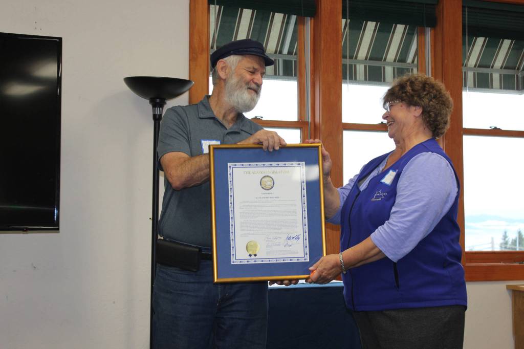 During the Homer Marine Trades meeting on Friday, Sept. 28, 2018, in Homer, Alaska, Rep. Paul Seaton presented Kate Mitchell with a Legislative Citation recognizing NOMARs contributions to the southern Kenai Peninsula in the past 40 years. (Photo by McKibben Jackinsky)