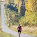 Palmers Christy Marvin climbs the last big hill on the Kenai Spur Highway on the way to victory in the womens Kenai River Marathon on Sunday, Sept. 30, 2018. (Photo by Jeff Helminiak/Peninsula Clarion)
