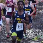 Homer runners Eyoab Knapp (341) and Luciano Fasulo (behind) and Kenai Central runner Maison Dunham race with the pack in the Division II boys race Saturday at the ASAA state cross-country running championships at the Bartlett Trails in Anchorage. (Photo by Joey Klecka/Peninsula Clarion)