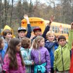 Students raise their hands to answer a question during an educational trip Thursday, Oct. 4, 2018 to the Anchor River in Anchor Point, Alaska. The egg take event is the first part of a year-long Salmon in the Classroom program. (Photo by Megan Pacer/Homer News)