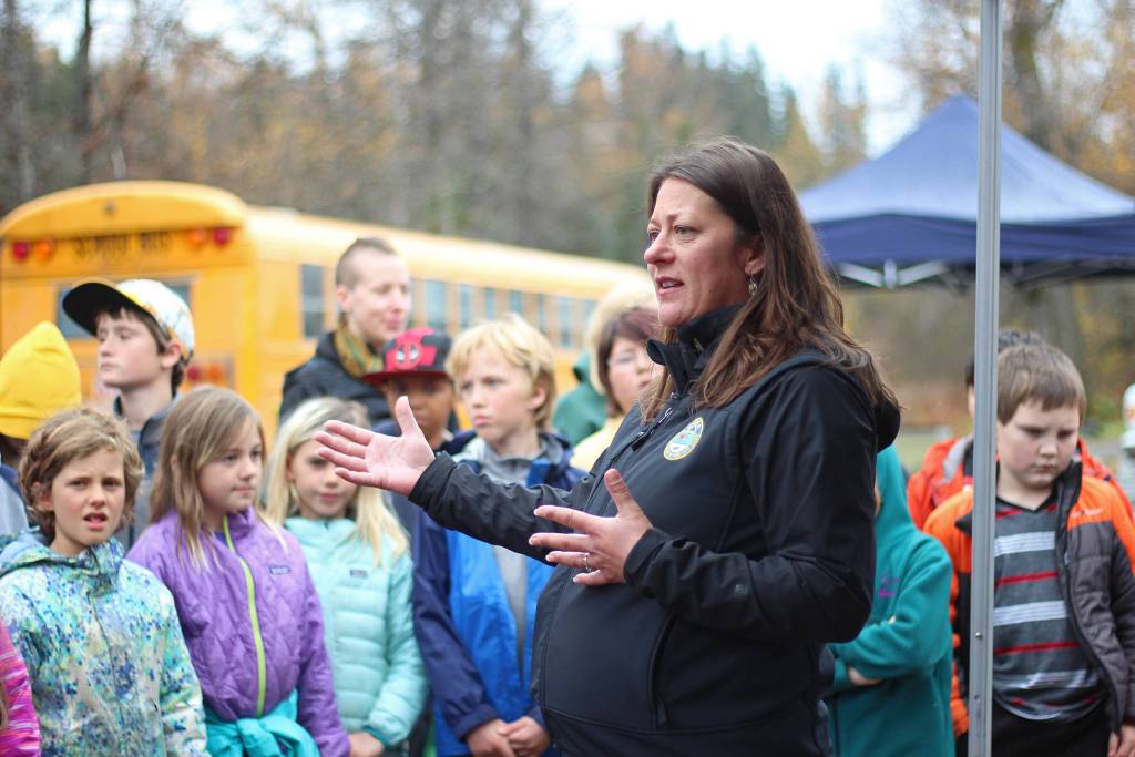 Fisheries Biologist Jenny Gates speaks with students from Chapman School and Fireweed Academy during an egg take trip Thursday, Oct. 4, 2018 at the Anchor River in Anchor Point, Alaska. (Photo by Megan Pacer/Homer News)
