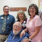 Dr. Paul Eneboe, front, with South Peninsula Hospital Long Term Care staff, from left to right, Robert Rutan, Sue Brooks and Ruth Lavrakas. (Photo by McKibben Jackinsky)