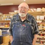 Dr. Paul Eneboe poses for a photo in his pottery shop in August 2018 in Homer, Alaska. (Photo by McKibben Jackinsky)