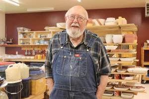 Dr. Paul Eneboe poses for a photo in his pottery shop in August 2018 in Homer, Alaska. (Photo by McKibben Jackinsky)