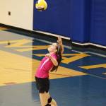 Homers Laura Inama jumps to serve the ball to the Soldotna High School volleyball team during their game Tuesday, Oct. 9, 2018 at Homer High School in Homer, Alaska. (Photo by Megan Pacer/Homer News)