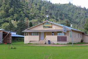 The Kachemak Selo Middle-High School building sits against a backdrop of the ridge separating the village from the Kenai Peninsula Borough road system Thursday, Aug. 30, in Kachemak Selo. (Photo by Megan Pacer/Homer News)