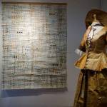 Keren Lowells Work Dress, right, at Bunnell Street Arts Center as seen at the First Friday, Oct. 6, 2018, opening in Homer, Alaska. (Photo by Michael Armstrong/Homer News)