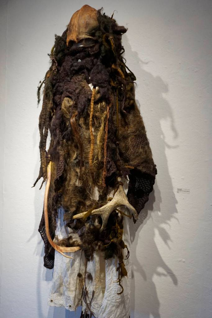 Keren Lowells Rough Beast, part of her show at Bunnell Street Arts Center as seen at the First Friday, Oct. 6, 2018, opening in Homer, Alaska. The title refers to a line in Willam Butler Yeats poem Second Coming: And what rough beast, its hour come round at last / slouches its way to Bethlehem to be born? Many of Lowells garments have poetic references. (Photo by Michael Armstrong/Homer News)