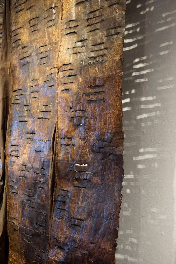A close up of Keren Lowells Groundwork show the textile art casting shadows on the wall of Bunnell Street Arts Center at the First Friday, Oct. 6, 2018, opening of Lowells show in Homer, Alaska. (Photo by Michael Armstrong/Homer News)