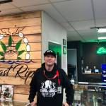 Ryan Tunseth stands at the counter of his business, East Rip, on Monday in Kenai. (Photo by Victoria Petersen/Peninsula Clarion)