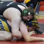 Nikiskis Ethan Hack controls Homers Hunter Harrington in the third-place match at 285 pounds Saturday, Oct. 13, 2018, at the Luke Spruill Memorial Tournament at Kenai Central High School. Harrington would win the match by pin. (Photo by Jeff Helminiak/Peninsula Clarion)