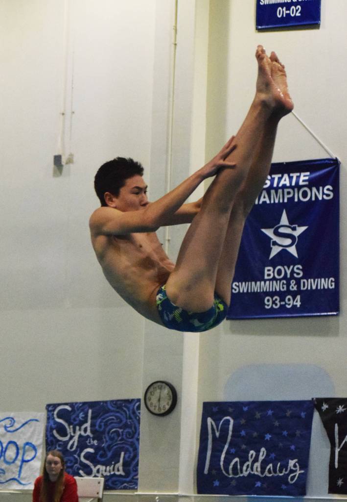 Soldotnas Sam Skolnick performs a dive at the SoHi dual meet Friday, Oct. 12, 2018 at Soldotna High School in Soldotna, Alaska. (Photo by Joey Klecka/Peninsula Clarion)