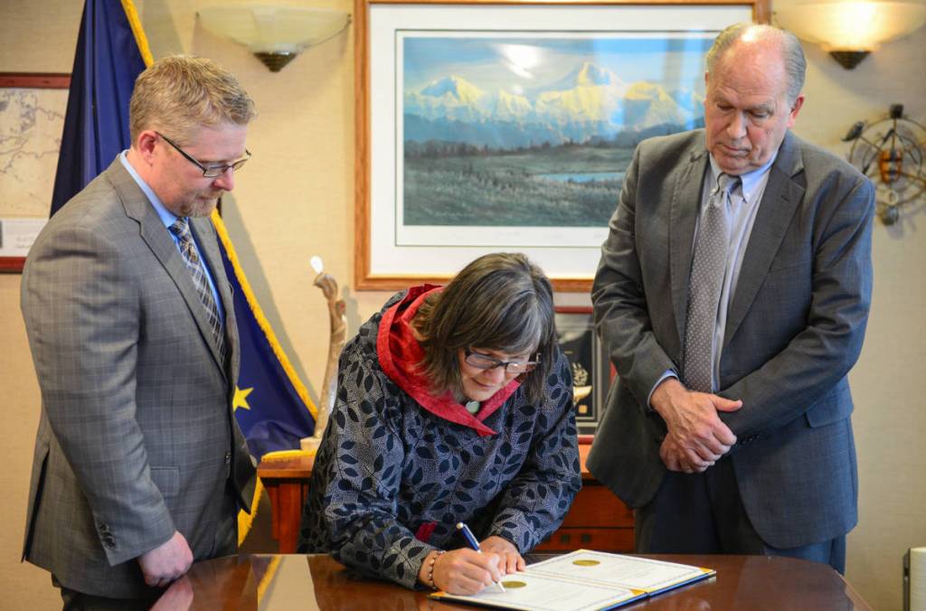 Valerie Davidson, left, takes the oath of office as Alaskas lieutenant governor on Tuesday, Oct. 16, 2018 from Gov. Bill Walker in Anchorage. (Office of the Governor | Courtesy photo)