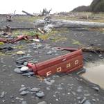 Storm tides have almost totally buried a Ford F-150 pickup truck on the beach south of Diamond Creek in this photo taken on Sunday, Oct. 14, 2018, near Homer, Alaska. The truck was abandoned on the beach in October 2011 and had then been on its tires. (Photo by Michael Armstrong/Homer News)