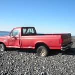 A Ford F-150 pickup truck sits abandoned on the beach about 2 miles south of Diamond Creek in this photo taken in October 2011 near Homer, Alaska The plates and vehicle identification number had been removed. (File photo by Michael Armstrong/Homer News)