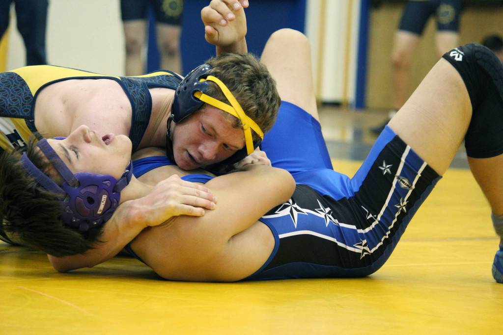 Homers Mose Hayes works on pinning Soldotnas Israel Alley, who he eventually defeated, during a dual match between the two schools Friday, Oct. 19, 2018 at Homer High School in Homer, Alaska. (Photo by Megan Pacer/Homer News)