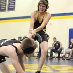 Voznesenkas Nestor Kalugin pulls his opponent, Nikiskis Jaryn Zoda, back into bounds during a dual match between their two schools Friday, Oct. 19, 2018 at Homer High School in Homer, Alaska. (Photo by Megan Pacer/Homer News)