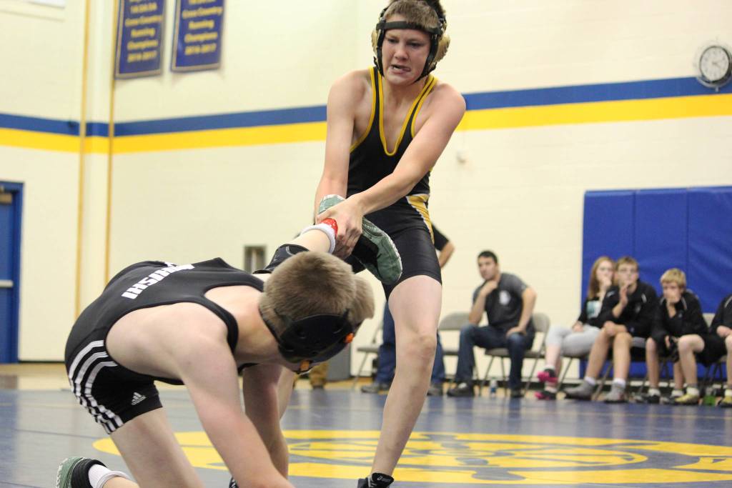Voznesenkas Nestor Kalugin pulls his opponent, Nikiskis Jaryn Zoda, back into bounds during a dual match between their two schools Friday, Oct. 19, 2018 at Homer High School in Homer, Alaska. (Photo by Megan Pacer/Homer News)