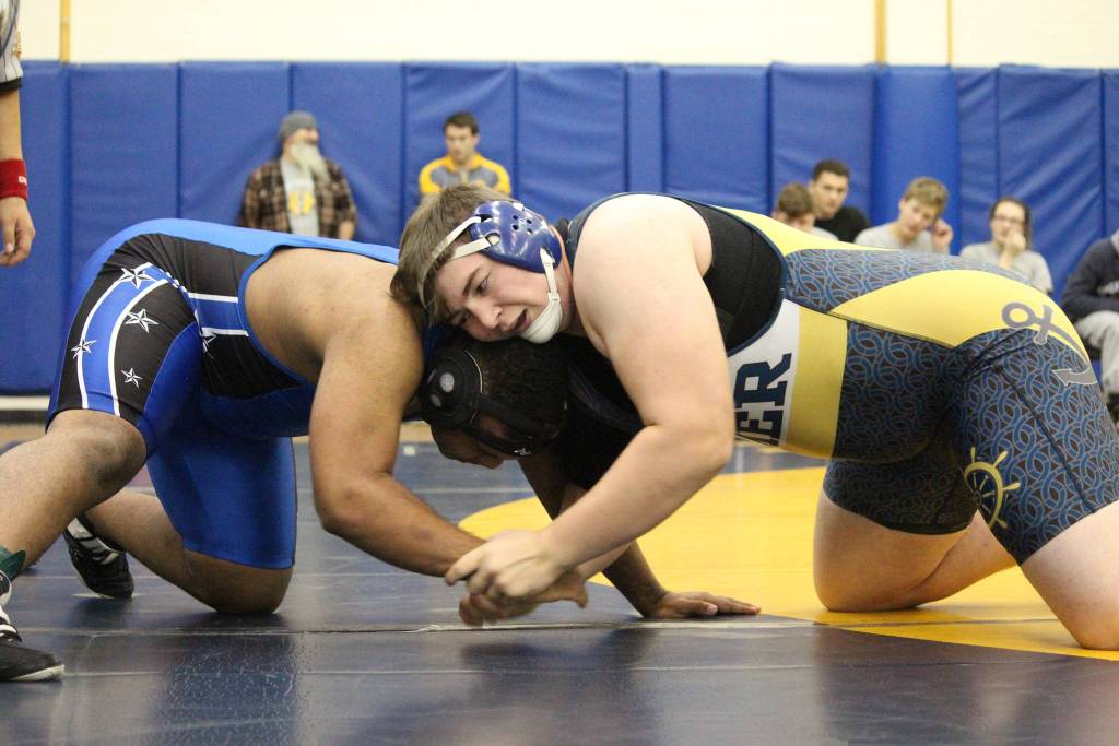 Homers Jadin Mann grapples with a member of Soldotnas wrestling team during a dual match between their two schools Friday, Oct. 19, 2018 at Homer High School in Homer, Alaska. (Photo by Megan Pacer/Homer News)