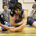 Homers David Weisser holds Soldotnas Brian Kuhr in a head lock while they wrestle Friday, Oct. 19, 2018 at Homer High School in Homer, Alaska. (Photo by Megan Pacer/Homer News)