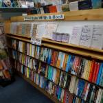 The Blind Date With a Book section at the Homer Bookstore on Oct. 29, 2018, in Homer, Alaska. Customers can buy wrapped copies of books and select which charity they would like to support. (Photo by Michael Armstrong/Homer News)