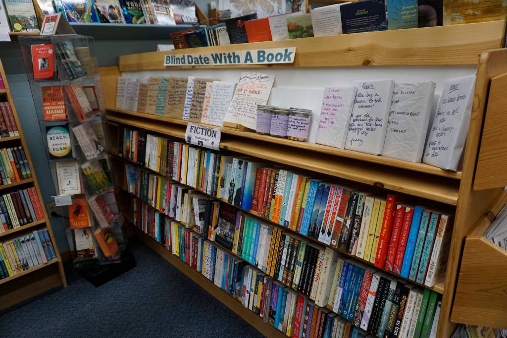 The Blind Date With a Book section at the Homer Bookstore on Oct. 29, 2018, in Homer, Alaska. Customers can buy wrapped copies of books and select which charity they would like to support. (Photo by Michael Armstrong/Homer News)